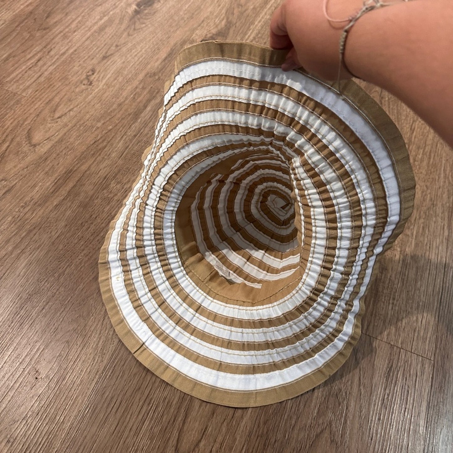 White and beige striped floppy sun hat