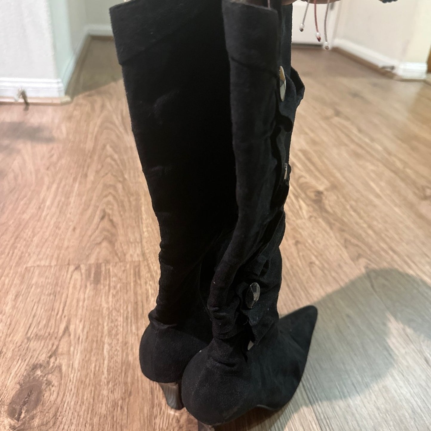 C. banner pointed toe heeled boots size 7