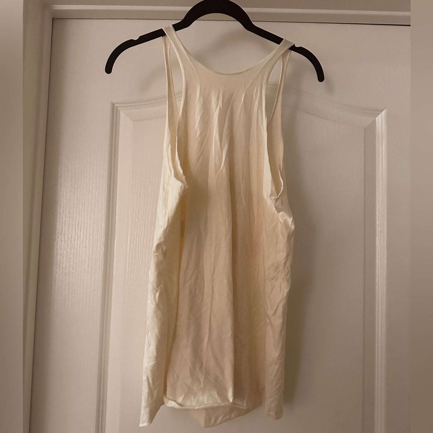 Cream tank with colorful sloth graphic