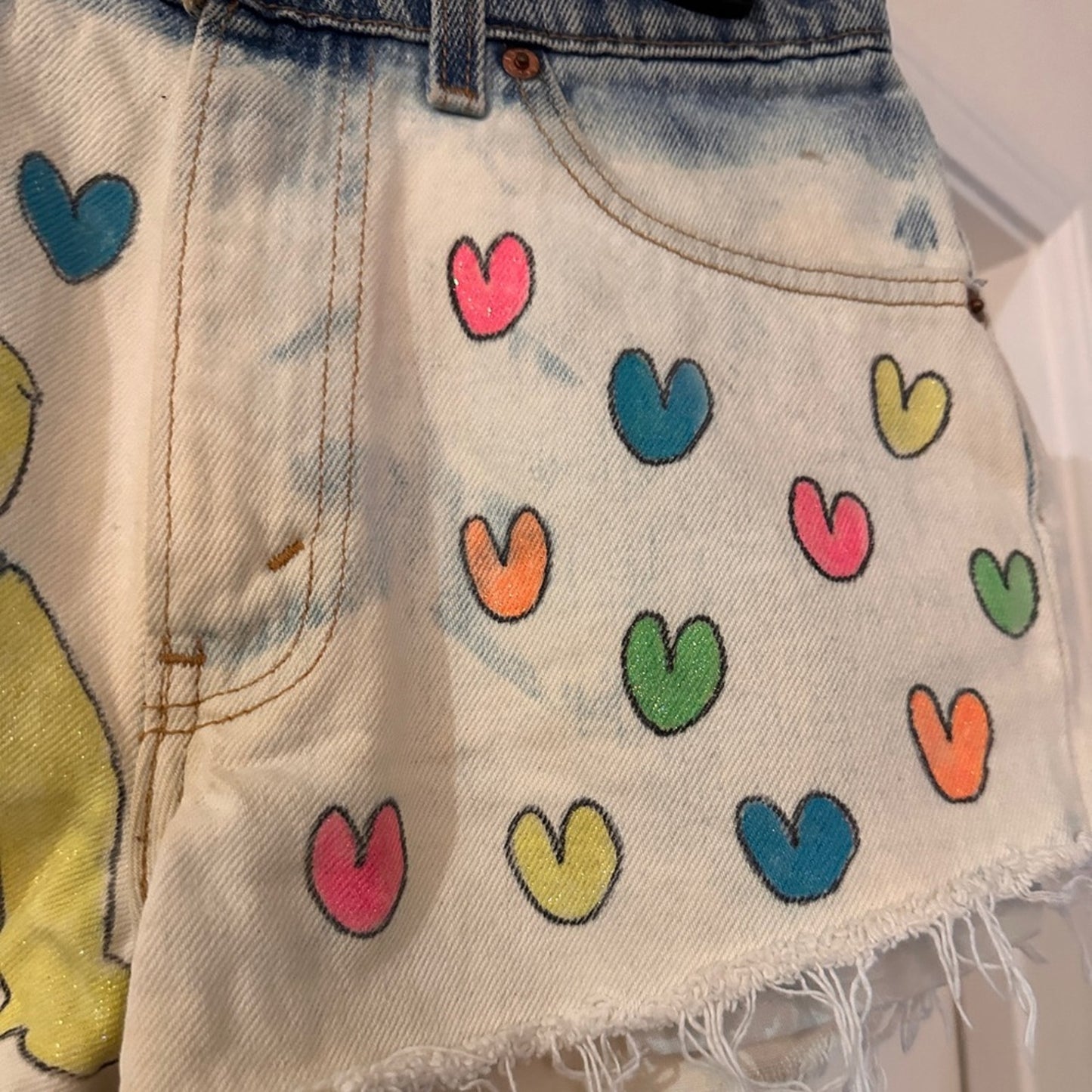 Care bear hand painted Levi’s distressed denim shorts size 28