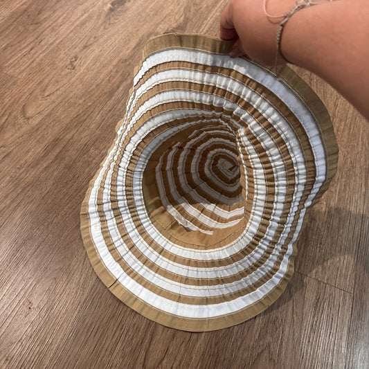 White and beige striped floppy sun hat